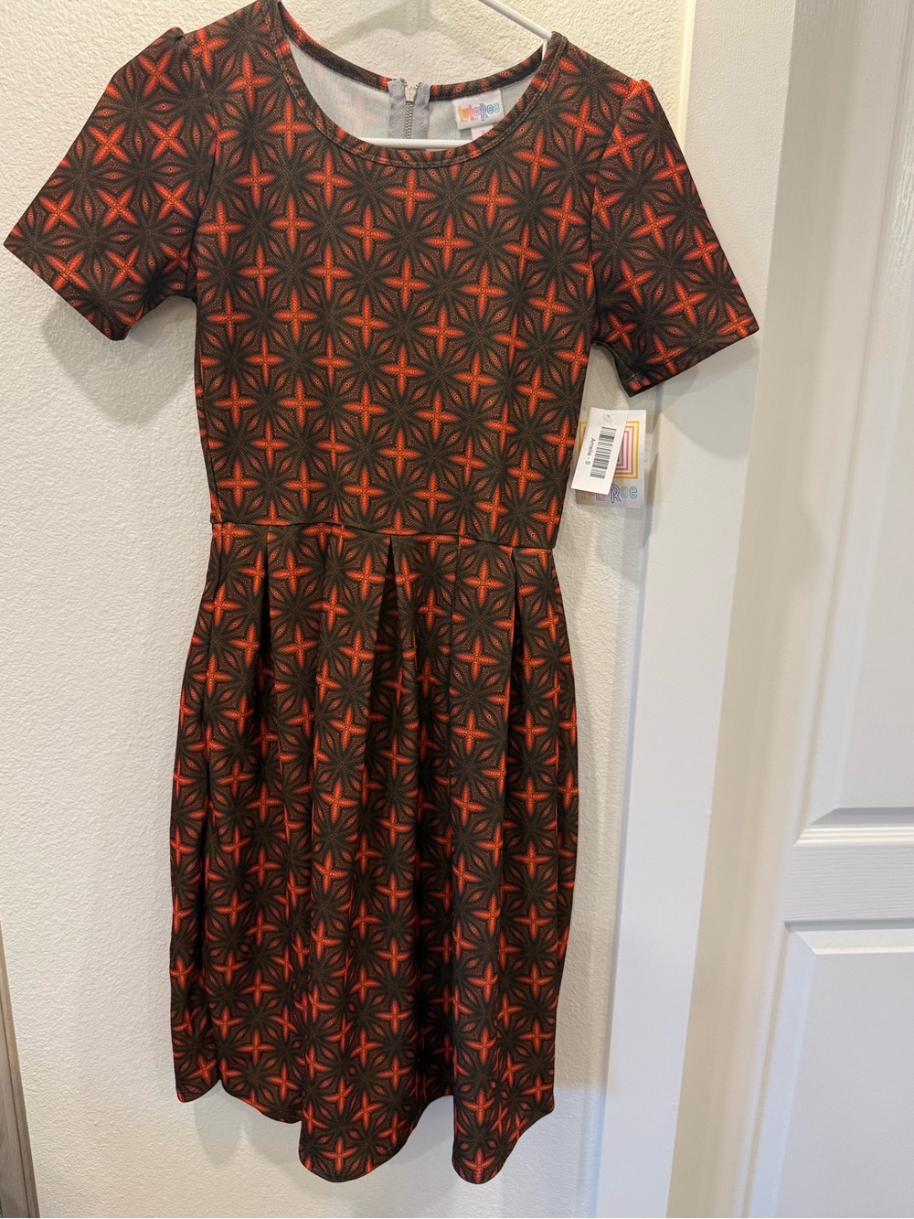 LuLaRoe Short Sleeve Amelia Dress with pockets… Orange and Black Starburst